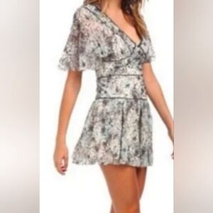Free People NWOT Perfect Dream floral Mini Dress. Cut out back deep V neck Fit &